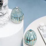 Candela profumata Ladenac “Uovo Blu” in ceramica con strisce oro 18k e strass– 220 g