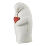 Scultura in porcellana "Colby – Pinguino protettore" con cuore rosso LLADRÓ