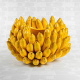 Vaso giallo in ceramica Werns con banane in ceramica